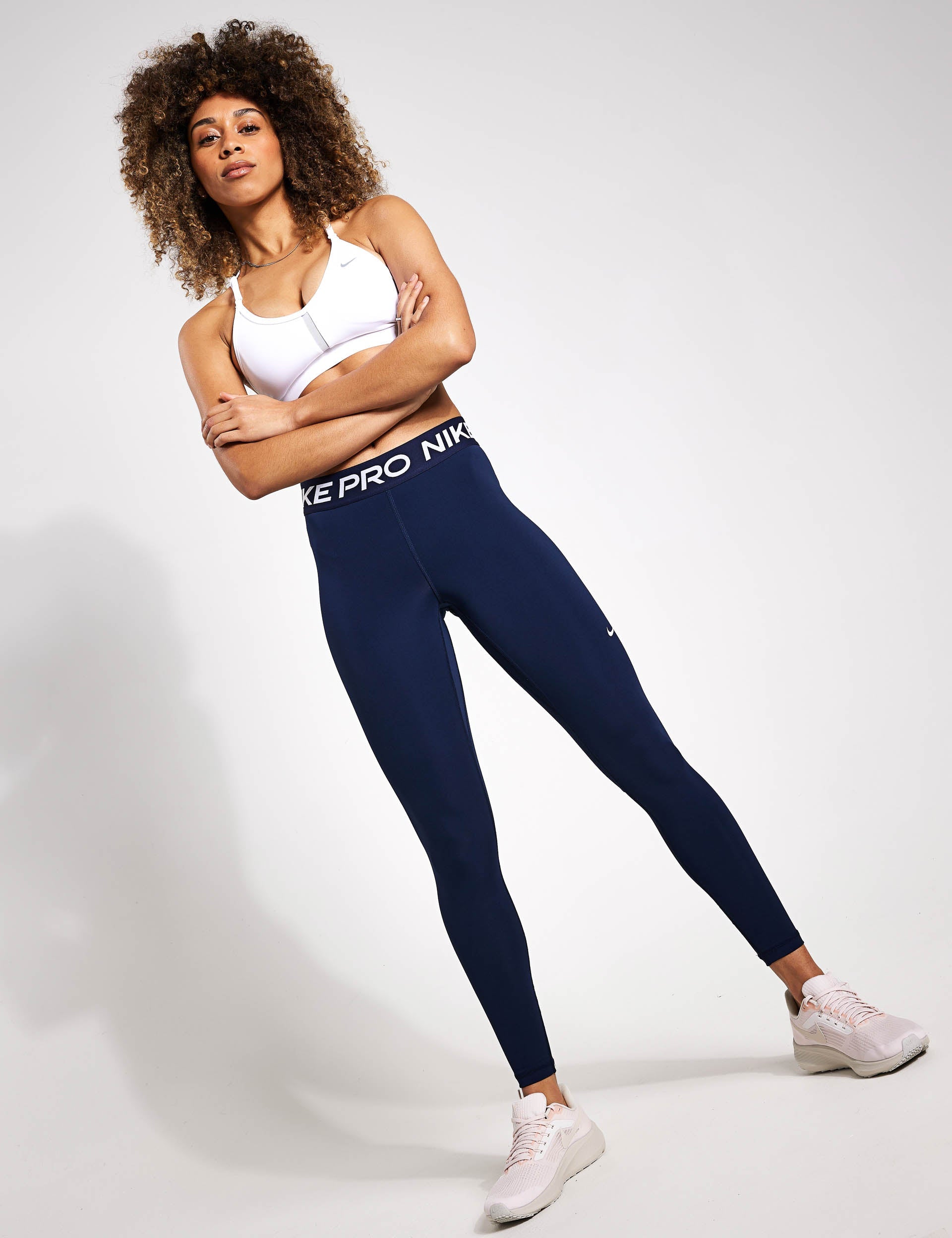 Nike Pro 365 Women's Mid-Rise Cropped Mesh Panel Leggings. Nike FI