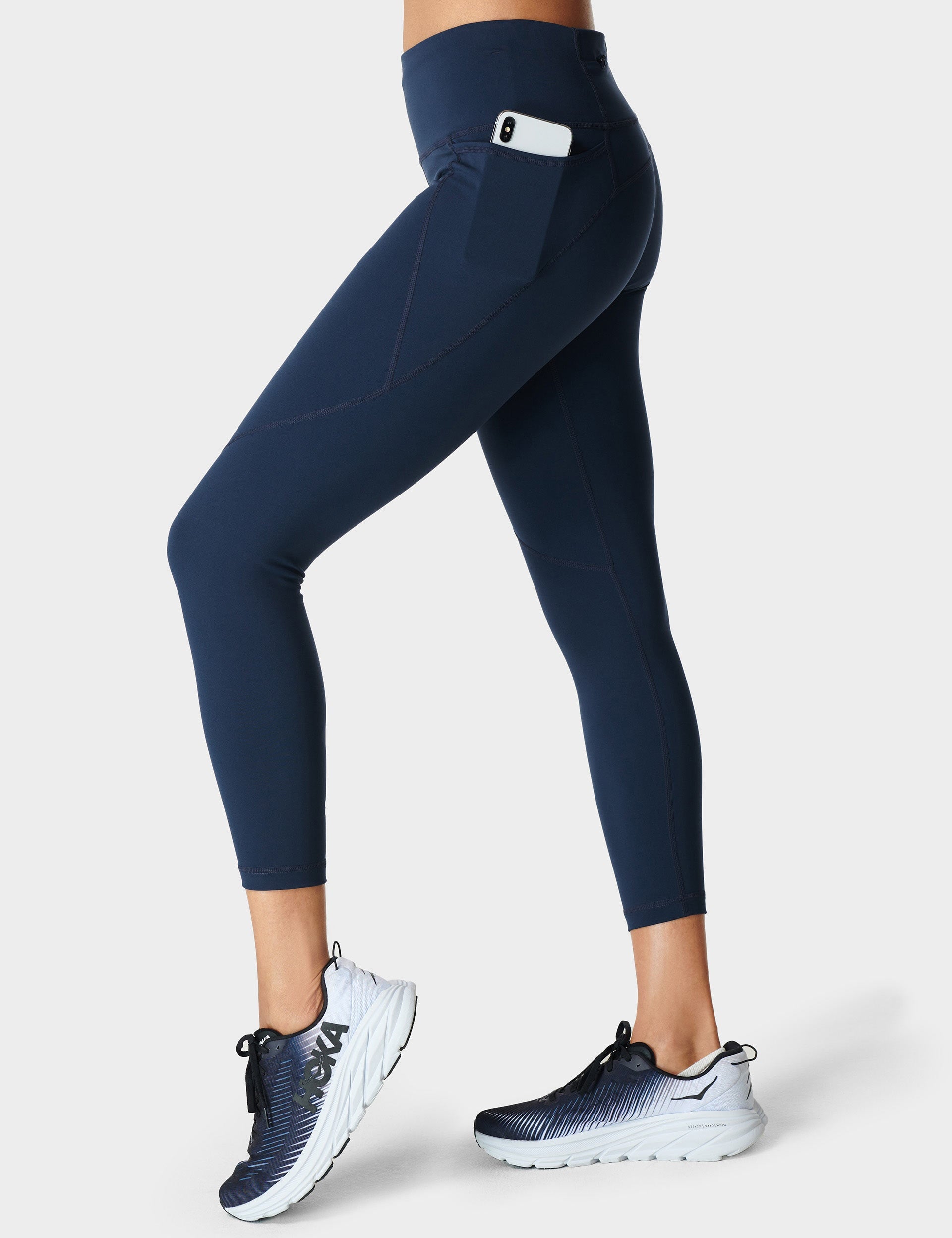 https://us.thesportsedit.com/cdn/shop/products/sweaty-betty-power-7-8-gym-leggings-navy-blue-sb5400_1.jpg?v=1692168258